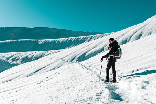 Woman Snow Hiking In Winter