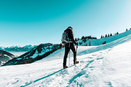 Woman Snow Hiking In Winter