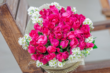 Wallpaper of flowers (roses) that are placed on chairs or wooden tables, to be displayed at festivals or on special occasions (Valentine, wedding, birthday, new year) 