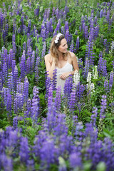 Girl with a bouquet of blue flowers