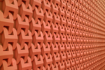 Decorative 3D pattern of building's outer wall in deep orange color