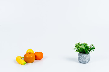 Tidy flowers or fruits and various kitchen tools on the white background.