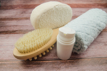 Soft towel and bath accessories on table