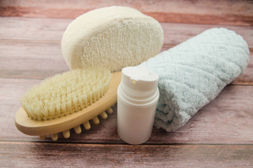 Soft towel and bath accessories on table