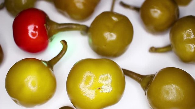 Green red cherry pepper rotating seamless looping food texture pattern close up footage