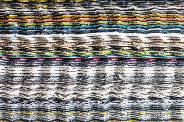 Background and texture of multi-colored fabric layers.