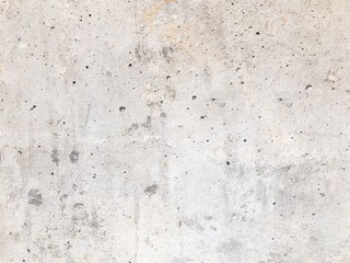 Mur en béton gris avec nombreuses aspérités