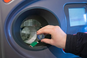 Recycling a Plastic Bottle in Recycling Machine