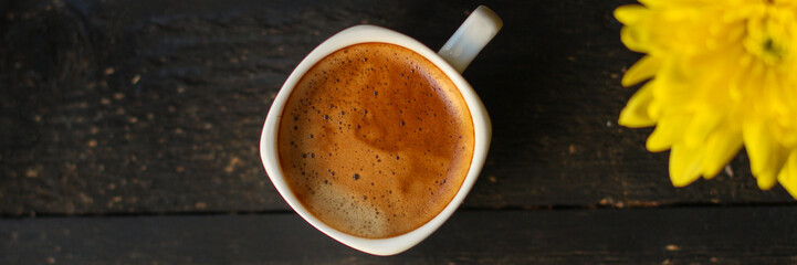 cup of hot coffee (coffee beans) - arabica and robusta blend, roasted coffee grain. Black background. Top view. Copy space
