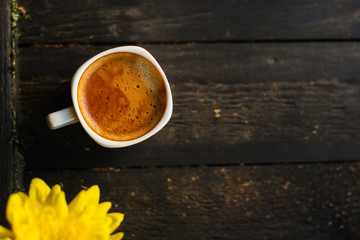 cup of hot coffee (coffee beans) - arabica and robusta blend, roasted coffee grain. Black background. Top view. Copy space