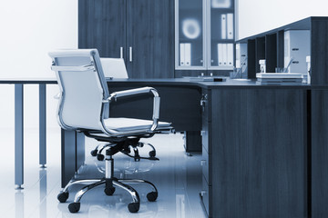 chair, table and bookcase on white wall