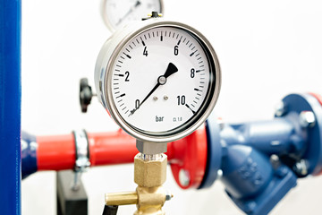 The equipment of the boiler-house, - valves, tubes, pressure gauges, thermometer. Close up of...