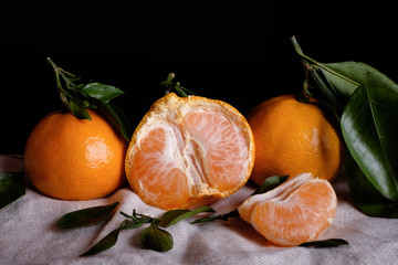 Fresh fruits tangerines or tangerines with leaves on the table