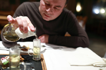 Man pouring green tea