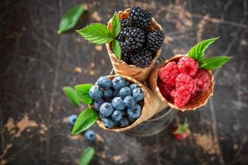 Delicious berry fruits in waffels as ice cream concept