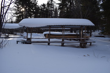 Wooden house in the village. Winter forest. Siberian hinterland.