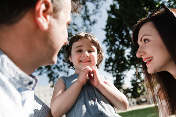 Smiling happy family and young funny daughter. Family concept.