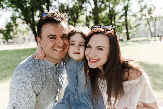Smiling happy family and young funny daughter. Family concept.