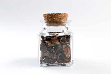 truffle in a glass jar isolated on white background