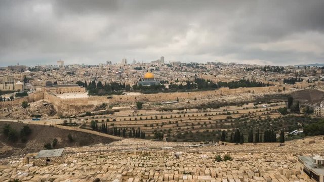 Time lapse view to Jerusalem old city Temple Mount and Dome of the Rock from the Mount of Olives at cloudy day, Israel