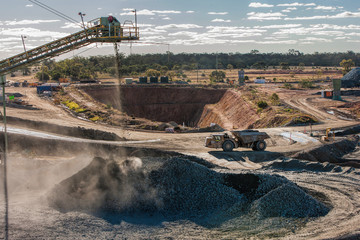 Rock crusher and truck equipment at a mine in NSW, Australia