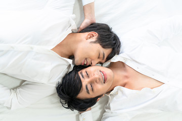 Fototapeta na wymiar Gay couple spending time in bed