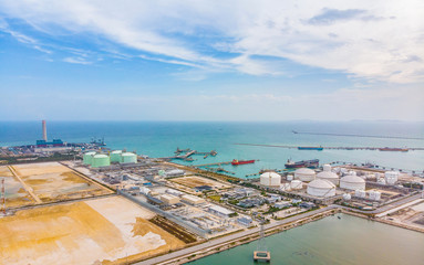 Fototapeta na wymiar Oil storage tank with oil refinery background, Oil refinery plant at day. Aerial view from drone top view