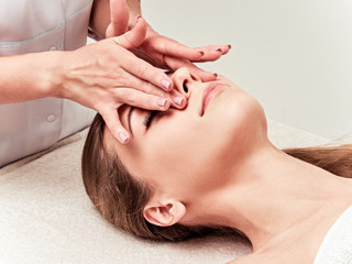 Leisure. Woman in spa salon. Massage and face care. Spa face massage woman hands treatment.