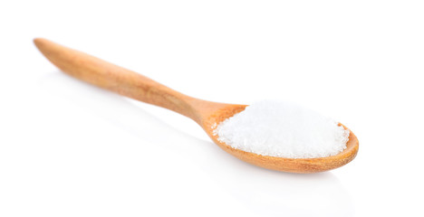 Salt in wooden spoon on white background