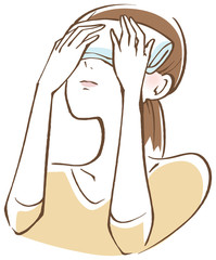 目に蒸しタオルを当てる女性