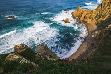 Beautiful ocean view of the Praia de Ursa, a wild place near touristic Cabo da Roca lighthouse, Portugal