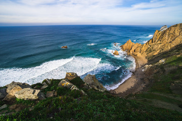Fototapeta premium Beautiful ocean view of the Praia de Ursa, a wild place near touristic Cabo da Roca lighthouse, Portugal