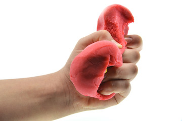 red play dough in hand