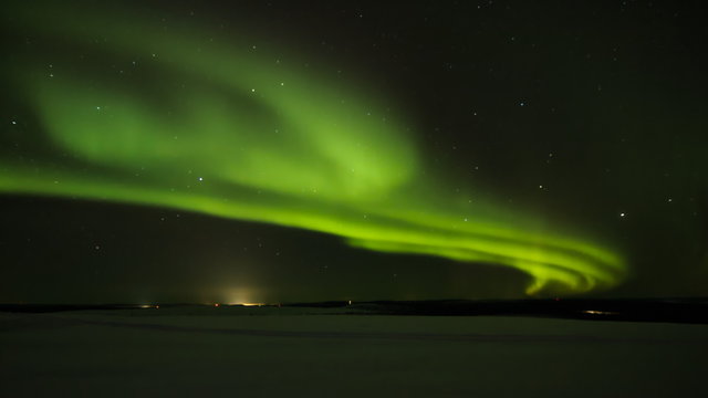 Northern light (aurora borealis) in the horizon above Ivalo from Saariselka in Finnish Lapland.