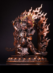 Vadzrapani is Buddha's defender and a symbol of its power. Bodhisattva in an angry image with a dorje in one hand and a lasso in another, against the background of tongues of flame. The figure made of