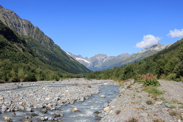 Fototapeta premium Close up view mountains and river scenes in national park Dombai, Caucasus