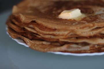 Maslenitsa with pancakes and a Cup of tea on the table for Breakfast