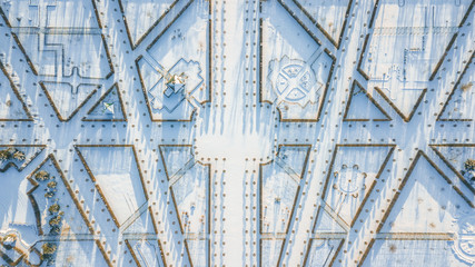  Aerial view of Rundale palace and baroque garden covered in snow at a sunny winter's day. Unique maze type french garden creates symmetrical view with different type of shapes. Pictures