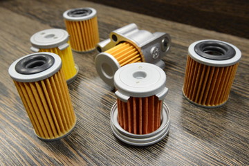 CVT transmission filters on wooden background 