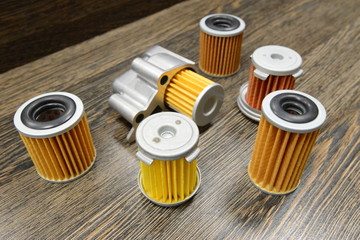 CVT transmission filters on wooden background 
