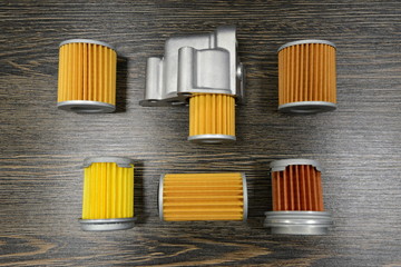 CVT transmission filters on wooden background 