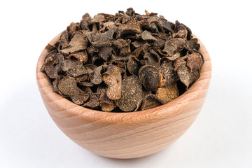 Truffle in wooden bowl isolated on white background. Closeup.
