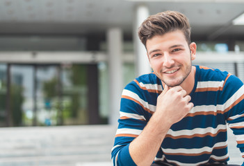 Trendy smiling man posing, handsome man, young guy.