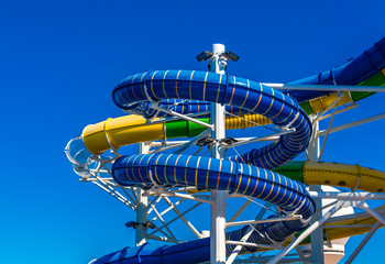 Curving and colorful waterslides on a luxury cruise ship