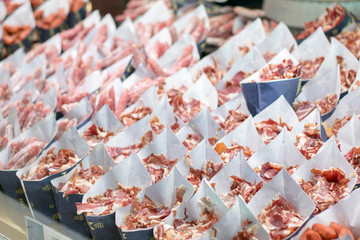 Dry Iberican Ham slices in San Miguel Market Madrid