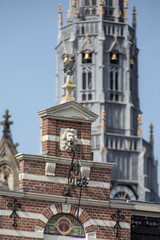 Fototapeta na wymiar Old facade and Church tower in Haarlem