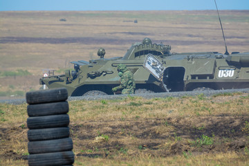 Russian armored personnel carrier in the military firing range