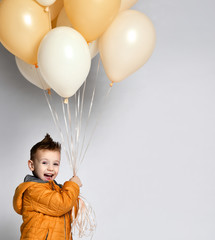 Stylish little boy holding air balloon isolated on white