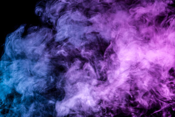 Fototapeta na wymiar Translucent, thick smoke, illuminated by light against a dark background, divided into three colors: blue, green, pink and purple, burns out, evaporating from a steam of vape for print on t-shirt