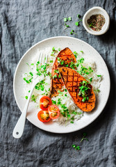 Baked sweet potatoes with rice and micro greens on grey background, top view. Vegetarian lunch